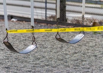 A set of swings are caution taped off during COVID-19 prevention measures.