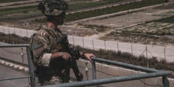 A soldier assigned to the 82nd Airborne Division provides security at Hamid Karzai International Airport, Afghanistan, August 21, 2021. Picture taken August 21, 2021.  U.S. Marine Corps/Cpl. Davis Harris/Handout via REUTERS THIS IMAGE HAS BEEN SUPPLIED BY A THIRD PARTY.