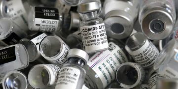 FILE - In this file photo dated Saturday, May 15, 2021, empty vials of the Pfizer-BioNTech COVID-19 vaccine lie in a box during a vaccine campaign at the Vaccine Village in Ebersberg near Munich, Germany.  Germany will start offering Pfizer-BioNTech coronavirus vaccinations for all children and teenagers aged 12 and older, as pressure mounts to vaccinate more young people as schools return from summer vacations. (AP Photo/Matthias Schrader, FILE)