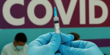 FILE PHOTO: A healthcare worker prepares a dose of Sputnik V (Gam-COVID-Vac) vaccine against the coronavirus disease (COVID-19) at a vaccination centre in Gostiny Dvor in Moscow, Russia July 6, 2021. REUTERS/Tatyana Makeyeva/File Photo