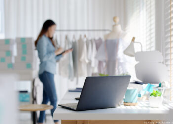 Digital tablet computer or laptop on home office desk with asia freelance seller woman happy packing check busy work in fashion studio SME online store social e-commerce sale page service web support.