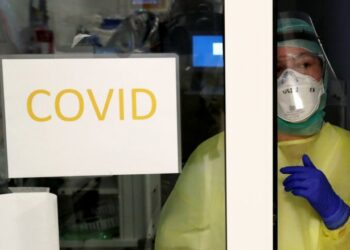 A member of the medical personnel works as patients suffering from coronavirus disease (COVID-19) are treated at the intensive care unit at CHIREC Delta Hospital in Brussels, Belgium, April 18, 2020. REUTERS/Yves Herman