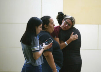 People react outside the Civic Center following a deadly school shooting at Robb Elementary School in Uvalde, Texas Tuesday, May 24, 2022. (AP Photo/Dario Lopez-Mills)