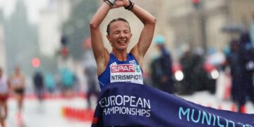 Athletics - 2022 European Championships - Munich, Germany - August 20, 2022 Greece's Antigoni Ntrismpioti celebrates as she crosses the line to win the Women's 20km Race Walk REUTERS/Lukas Barth