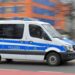 A police vehicle drives during a demonstration against government measures to curb the spread of the coronavirus disease (COVID-19) in Dresden, Germany, January 22, 2022. REUTERS/Matthias Rietschel