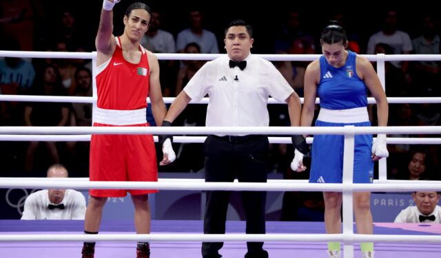 epa11515326 Imane Khelif (L) of Algeria is declared winner aber Angela Carini of Italy abandoned their bout in the Women 66kg preliminaries round of 16 against Imane Khelif of the Boxing competitions in the Paris 2024 Olympic Games, at the North Paris Arena in Villepinte, France, 01 August 2024.  EPA/YAHYA ARHAB