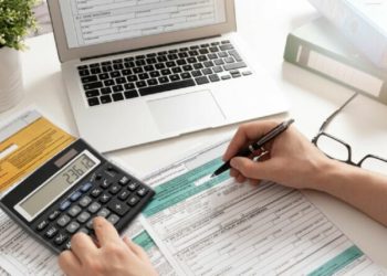 Polish individual income tax return. Accountant working with Polish tax forms