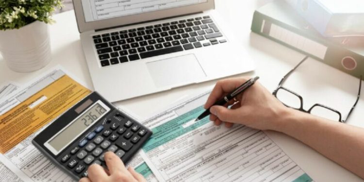 Polish individual income tax return. Accountant working with Polish tax forms